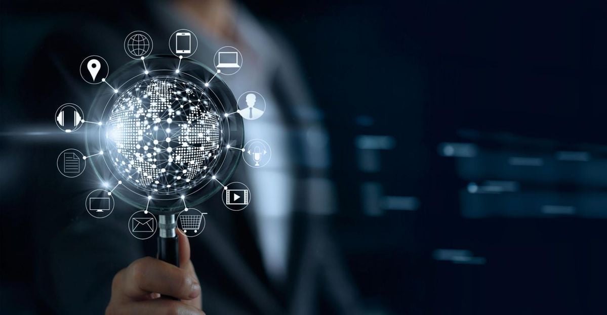 digital image of a hand holding a globe with multiple images displayed from it