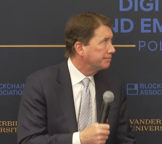 Senator Bill Hagerty holding a microphone