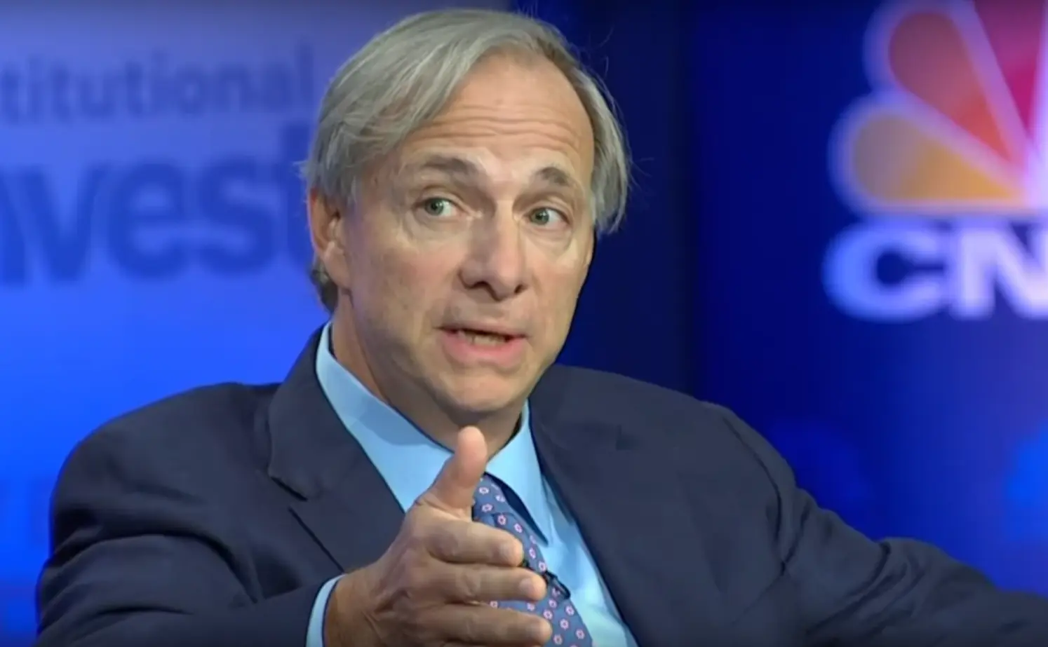 Ray Dalio speaking during a televised financial interview