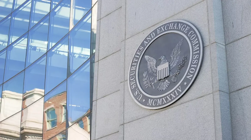 Seal of the U.S. Securities and Exchange Commission (SEC) mounted on the exterior wall of a modern office building with reflective glass windows.