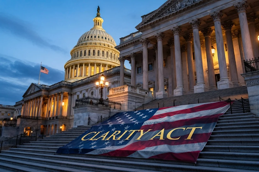 The U.S. Capitol building at dusk with a large American flag banner reading “CLARITY ACT” displayed across the steps.