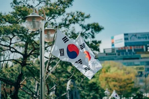 South Korean flags waving on a lamppost 