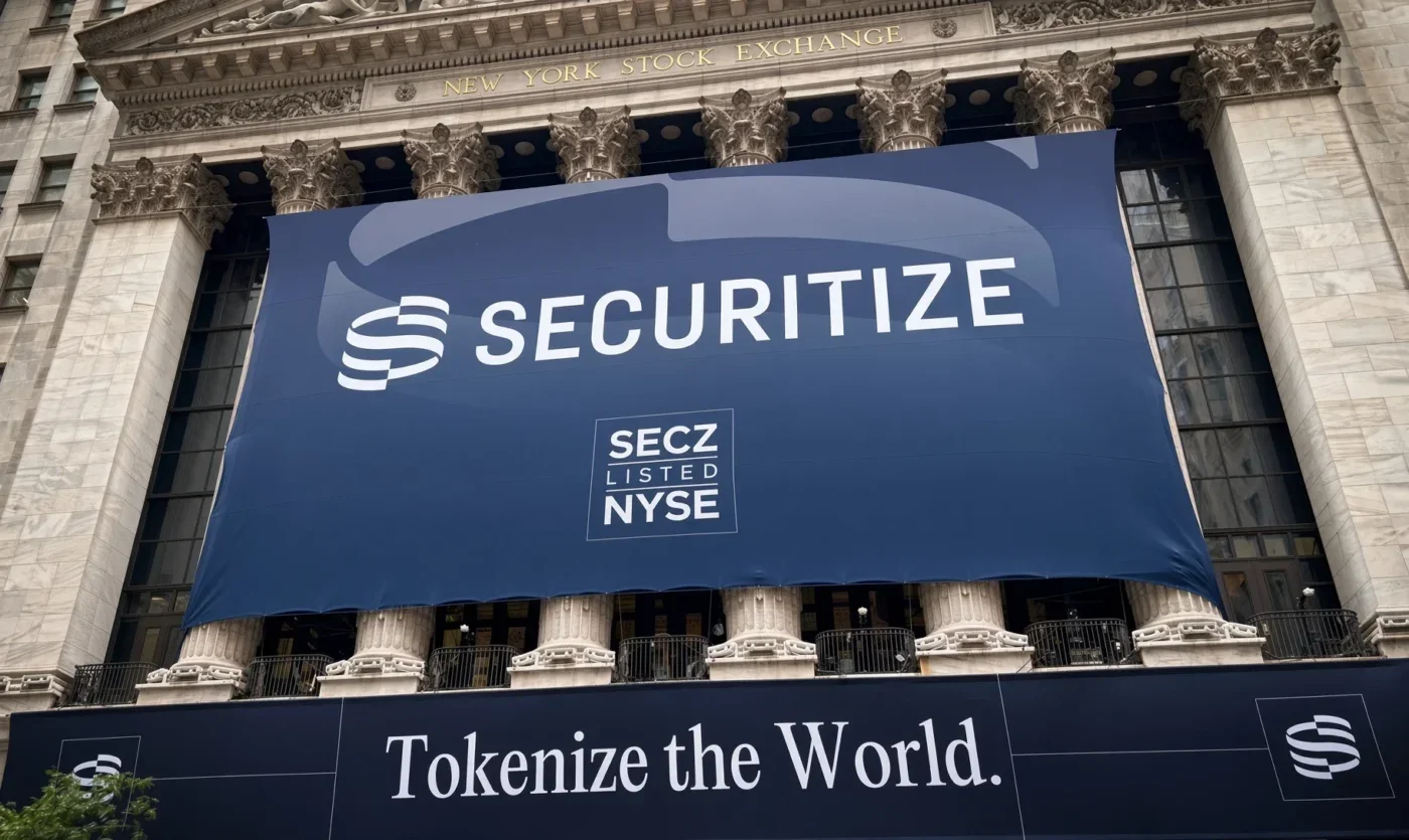 Securitize banner displayed on the New York Stock Exchange building with the text “Tokenize the World.”
