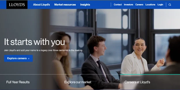 Lloyd’s webpage shows pictures of two women and two men. One woman wears a white suit, and one man wears a black suit with action buttons displayed and the tagline “It starts with you.”