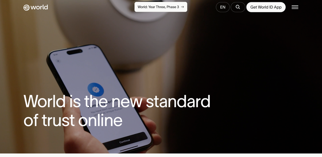An image of the World Network webpage shows a hand holding a mobile phone with a confirmation display and a continue action button, with the tagline “World is the new standard of trust online.